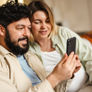 Parents watching Mobile Screen